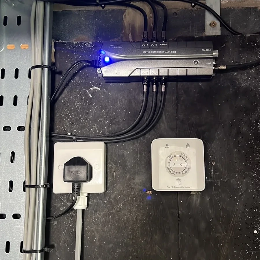 Control gear and a switched socket wired inside an equipment cabinet