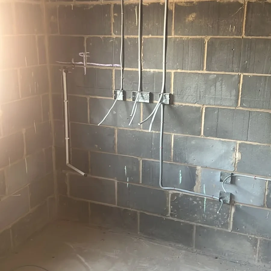 First-fix conduit and back boxes on blockwork