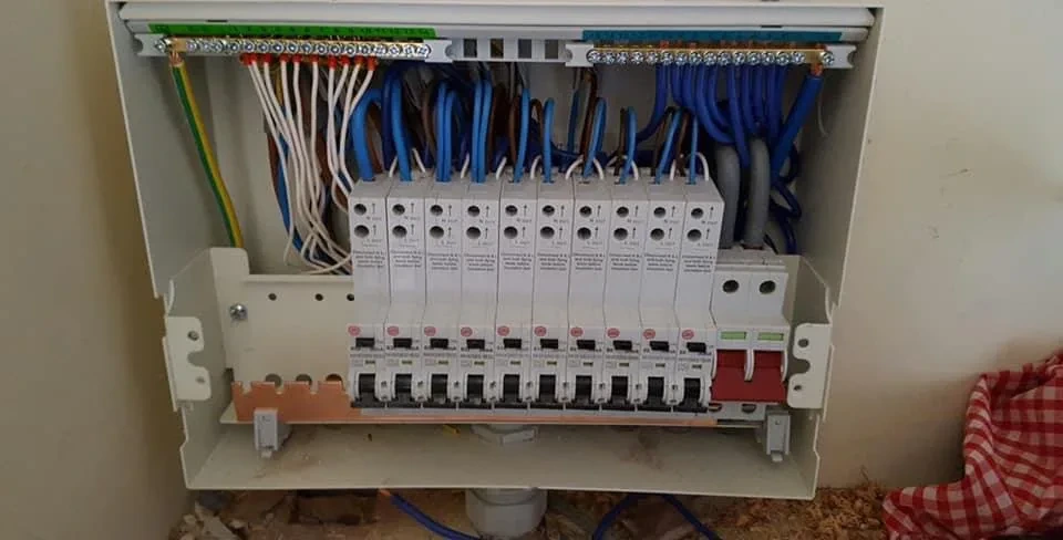 Consumer unit wired into a domestic wall, cover off
