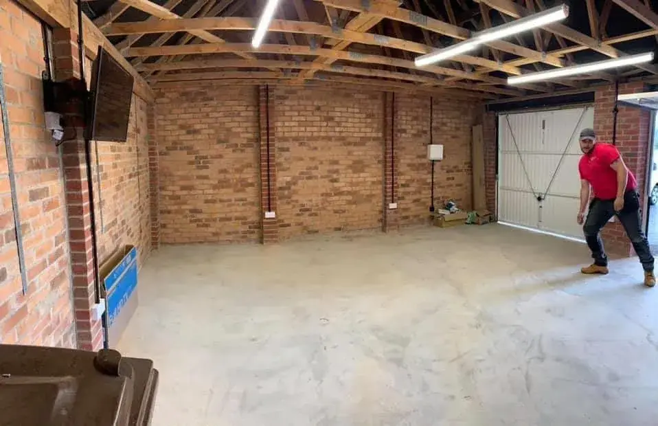 LED batten lighting and power sockets in a garage workshop