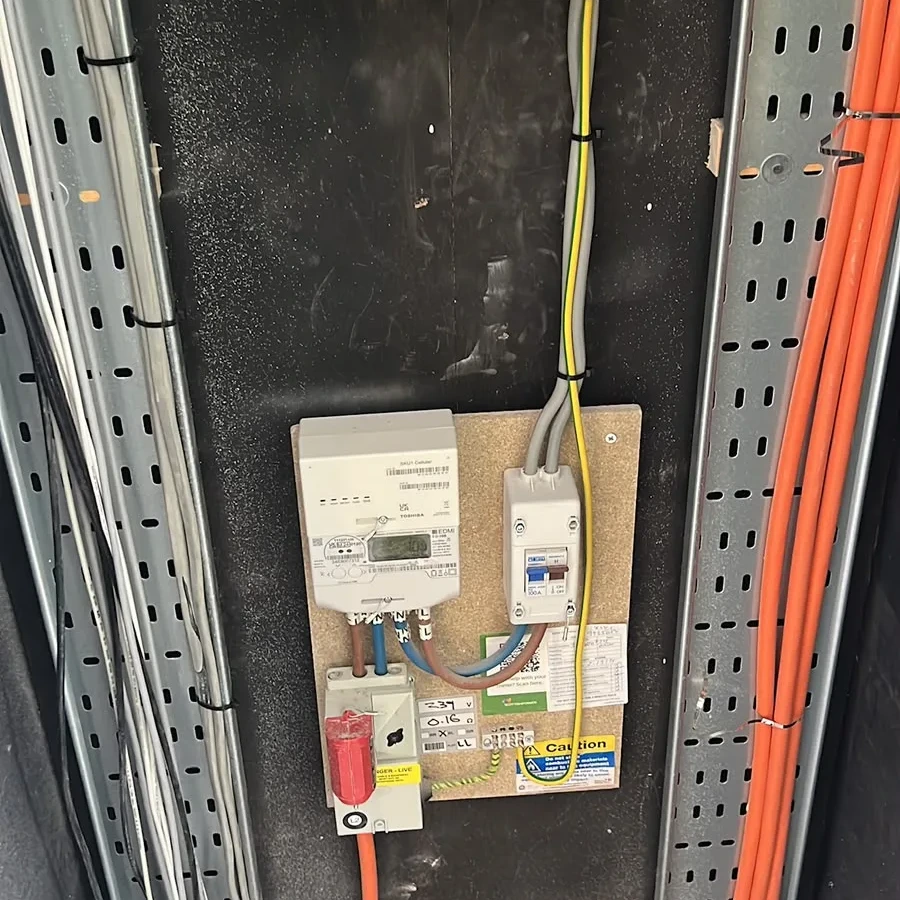 Meter, isolator and supply tails in a service riser